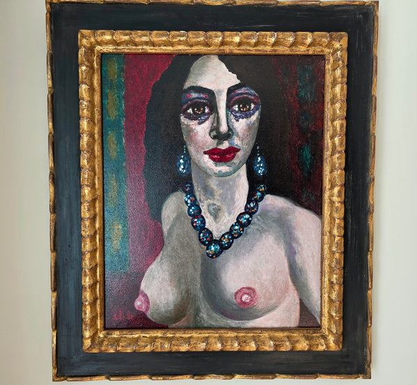 Portrait of a woman with lots of make up and bare breasts, framed with a black and gold frame