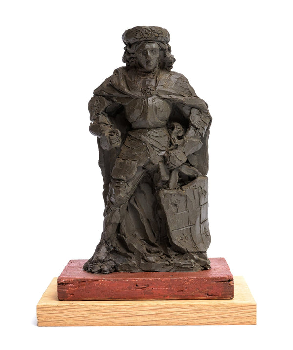 Unfired clay sculpture (unica), the saint shown as a knight, mounted on a polychromed wooden base, made by Lambertus Zijl. frontside