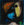 Schilderij van Eugène Brands uit 1961, abstract gezicht met zwarte vormen en vlakken in blauw, oranjerood en geelgroen.