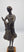 Bram Roth | The Washerwoman | Bronze sculpture on wooden base | Height 40 cm | Depiction of a woman in a dress / the washerwoman | Close-up picture