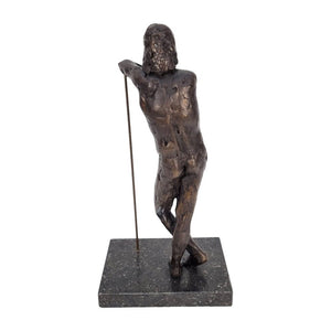 backside of bronze sculpture of a standing male nude leaning on a stick, Height: 30.5 cm. Length: 11 cm. Width: 15.2 cm.
