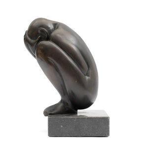 Crouching Figure by Theo Germann, 1984, side left view with the head facing right, mounted on a hardstone base.
