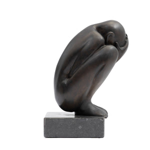 Crouching Figure by Theo Germann, 1984, side right view with the head facing right, mounted on a hardstone base.