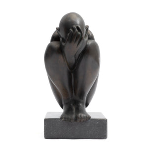 Crouching Figure by Theo Germann, 1984, bronze sculpture with drawn-up knees and hands covering the face, front view.