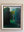 Dolf Zwerver, Woman in a Garden (1988), oil on panel depicting a woman in a blue dress standing between tall green hedges in an enclosed garden with frame