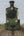 Painting by Herman Berserik from 1975 depicting a green locomotive on railway tracks, titled The Tram to Spijkenisse. unframed