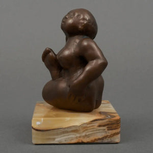 Rudolf Schwaiger | “Eva” | Brown-patinated bronze sculpture | 15 × 9 × 9 cm | 1973 | Natural stone base | Signed | leftside view