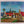 big painting by Toon Tieland, oil on canvas, village with bright colors and three figures with frame